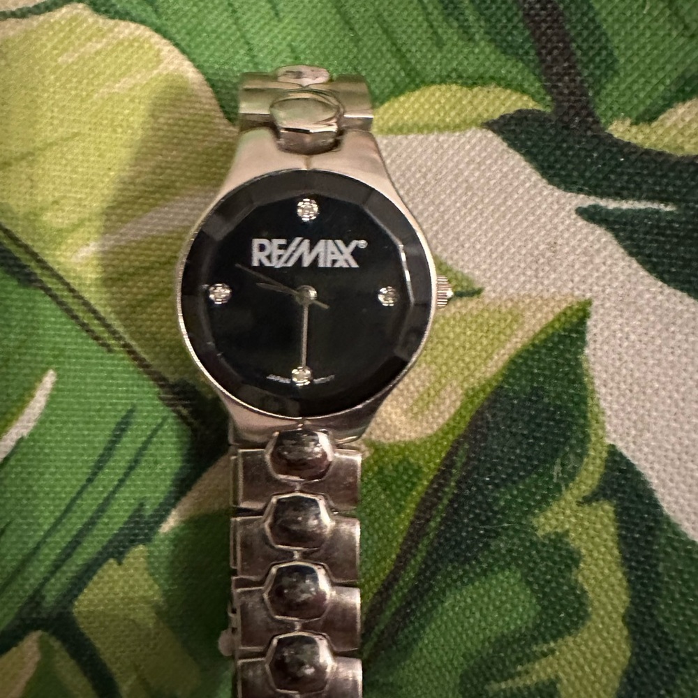 RE/MAX Ladies watch with NEW battery. Worn only handful of times. Elegant